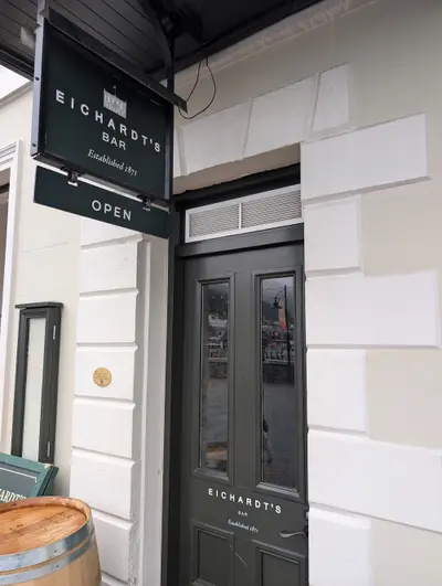 Sign and street entrance to Eichardt's Bar